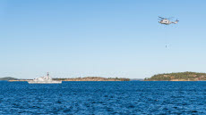 Undervattensstrid med tung helikopter och minröjningsfartyg.