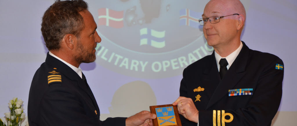 Change of Command at NCGM, Jan Dunmurray hand over the shield to Lars Berglund, SWEDINT, NCGM.