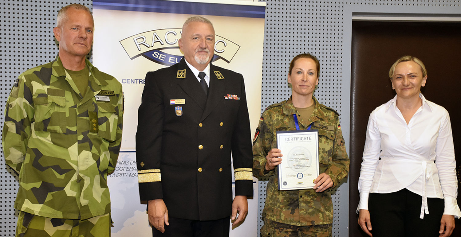 LtCol Olov Kesselmark (NCGM), R Adm Predrag Stipović (Deputy Director RACVIAC) congratulates student LtCol/Dr Liza Ding with course director Nura Mulavdić.